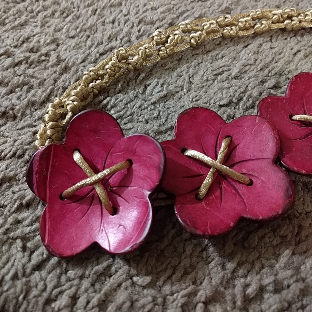 belt with coconut shell flowers detail